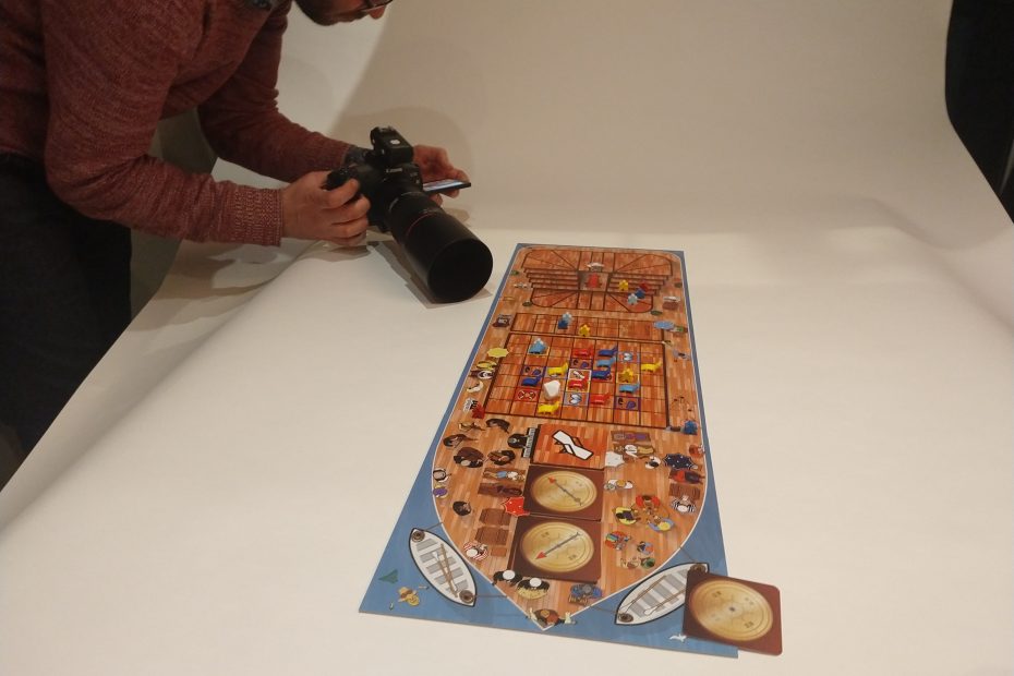 Owen takes a photo of the board game