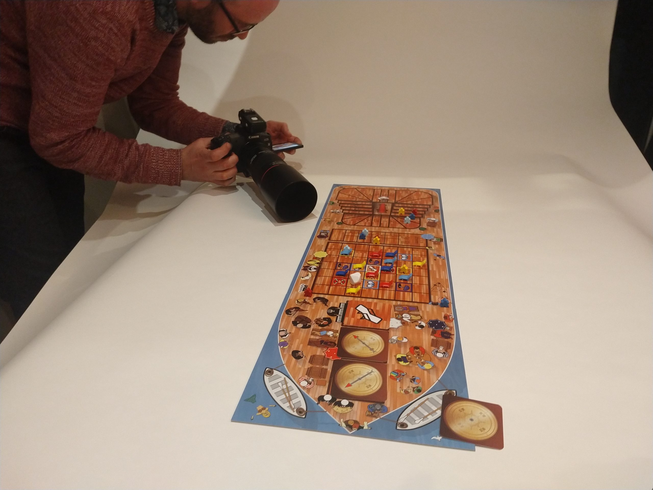 Owen takes a photo of the board game